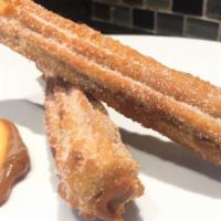 Churros Pan Dulce · Two house made churros filled with caramel.