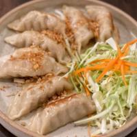 Pot Sticker · Dumpling filled with chicken and cabbage. Served with dumpling sauce.