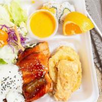 Salmon Teriyaki · Served with salad rice tempura and two pieces cal roll.