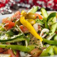 Mediterranean Salad · Gluten-free. Cucumbers, bell peppers, tomatoes, onions, parsley, lettuce, lemon, and olive o...