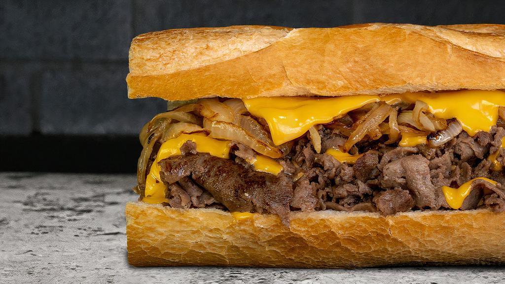 Phenomenal Philly Cheesesteak. · Thinly Sliced Ribeye Steak | Melted American | 
Grilled Onions | On A Warm Hero