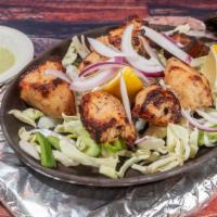 Malai Kebab · Succulent chicken cubes marinated with Cardamom cream, yogurt, and cooed in an Indian clay o...