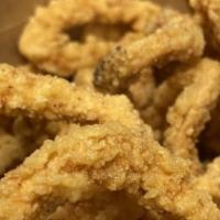 Fried Calamari · Squid Rings battered in our flour to give a super crispy texture. One of our best selling sn...