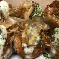 Takoyaki (6) · Octopus flavored balls with our house sauce and flakes on top. Comes in six pieces.