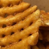 Waffle Fries · Crispy, meaty and tasty seasoned waffle fries. You can't never get enough of them.