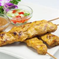 Satay Chicken · Skewered slice of marinated chicken served with peanut sauce and cucumber vinaigrette. (4 pc...
