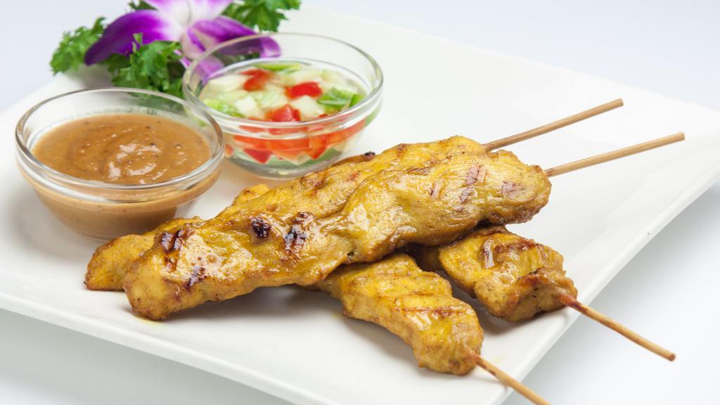Satay Chicken · Skewered slice of marinated chicken served with peanut sauce and cucumber vinaigrette. (4 pcs.)