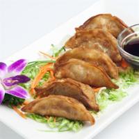 Steamed Dumplings · Dumplings filled with ground chicken, cabbage and scallion served with sweet soy sauce. (8 p...