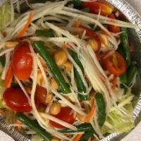 Som Tum (Papaya Salad) · Level of spiciness: Not Spicy/Mild/Medium/Hot. Shredded green papaya mixed with Thai chili, ...
