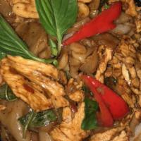 Drunken Noodles · Spicy flat rice noodle in basil sauce with tomato, bell pepper, onion, and basil.