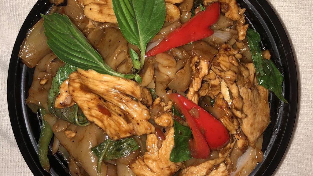 Drunken Noodles · Spicy flat rice noodle in basil sauce with tomato, bell pepper, onion, and basil.