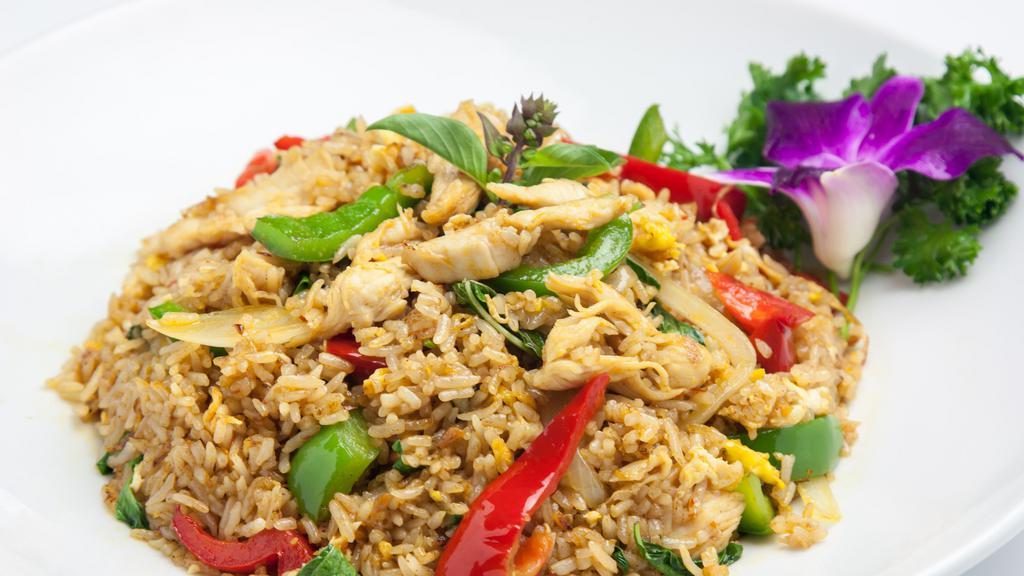 Spicy Fried Rice · Level of spiciness: Not Spicy/Mild/Medium/Hot. Steamed rice, chili, egg, red & green bell pepper, onion, garlic, and basil leaves.