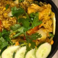 Pineapple Fried Rice · Fried rice, pineapple, onions, carrots, eggs, cashew nuts and yellow curry flavor.