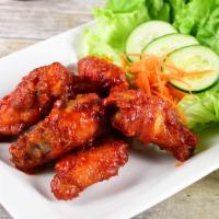 Vt Wings (6) · Deep-fried chicken wings combined with sweet chili sauce from VT recipe.
