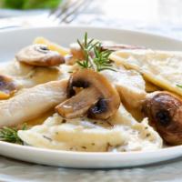 Ravioli With Beef · Delicious ravioli stuffed with beef. Served with garlic bread and garden salad.