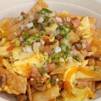 Spicy Scramble · Classic scrambled egg with spicy chorizo, American 
cheese, homemade crispy tortilla chips &...