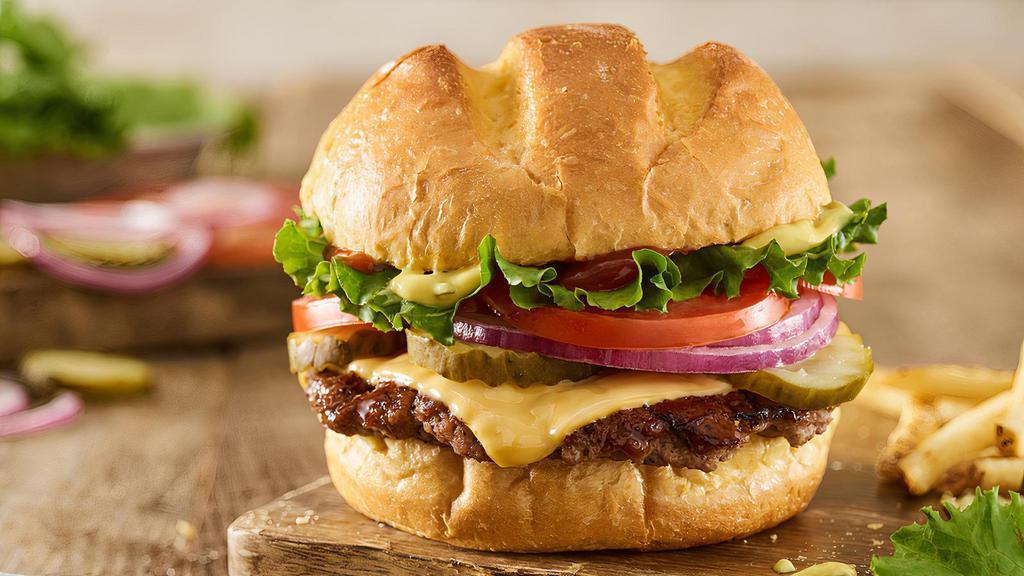 Classic Smash® Burger · Certified Angus Beef, American cheese, lettuce, tomatoes, red onions, pickles, Smash Sauce®, ketchup, toasted bun