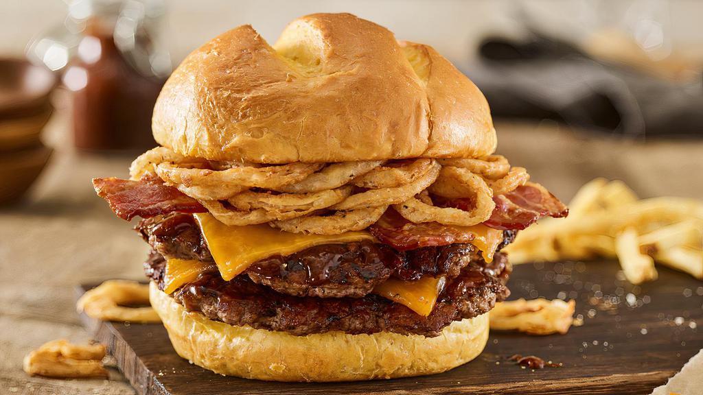 Double Bbq Bacon Cheddar Burger · Double Certified Angus Beef, aged cheddar cheese, applewood smoked bacon, haystack onions, bbq sauce, toasted bun