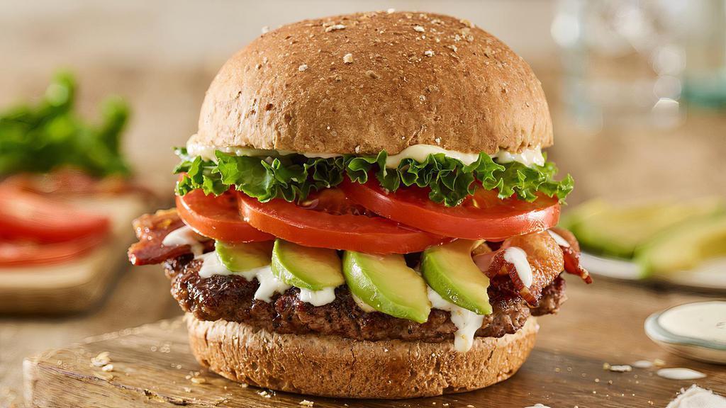 Avocado Bacon Club Burger · Certified Angus Beef, sliced avocado, applewood smoked bacon, lettuce, tomatoes, ranch, mayo, toasted multi-grain bun