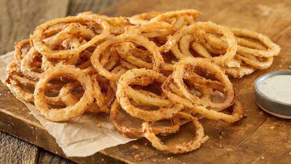 Haystack Onions · Crispy, fried onion straws served with ranch dressing