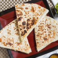 Cheese Quesadilla · Flour tortilla stuffed with melted Monterrey jack, served with guacamole and sour cream.