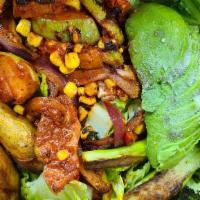 Fajita Salad · Vegan. Charred broccoli, burnt romaine, avocado, peppers, onion, achiote squash, roasted cor...