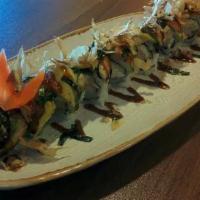 Dragon Roll · Shrimp tempura imitation crab, cucumber & avocado roll topped w/ eel, bonito flakes, massago...