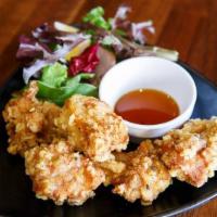 Crispy Chicken 5Pc · Juicy fried chicken thigh with an original garlic pepper served with mixed baby greens and J...