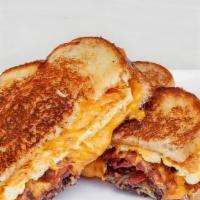 Bbq Chicken Brekkie Melt · Two fried eggs, melted Cheddar and Jack cheese, chicken, caramelized onions and BBQ sauce be...