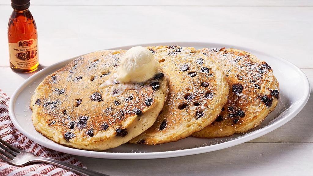 Chocolate Chip Pancakes – Three · Three Buttermilk Pancakes n’ butter with chocolate chips.