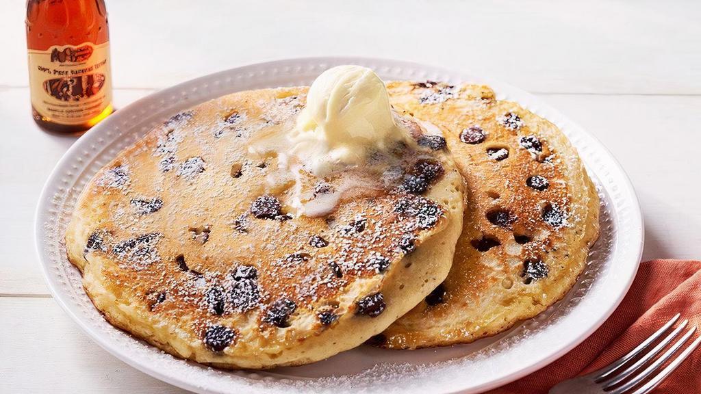 Chocolate Chip Pancakes – Two · Two Buttermilk Pancakes n’ butter with chocolate chips.