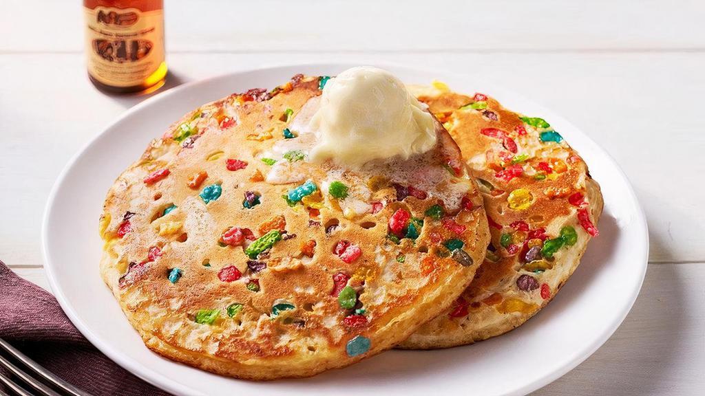 Confetti Pancakes – Two · Two Buttermilk Pancakes mixed with fruity cereal n’ topped with butter