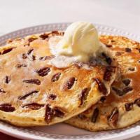 Pecan Pancakes – Two   · Two Buttermilk Pancakes n’ butter with pecans.