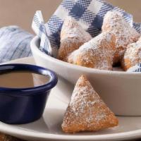 Biscuit Beignets · Our buttermilk biscuit dough, deep-fried then tossed in cinnamon sugar with butter pecan sau...