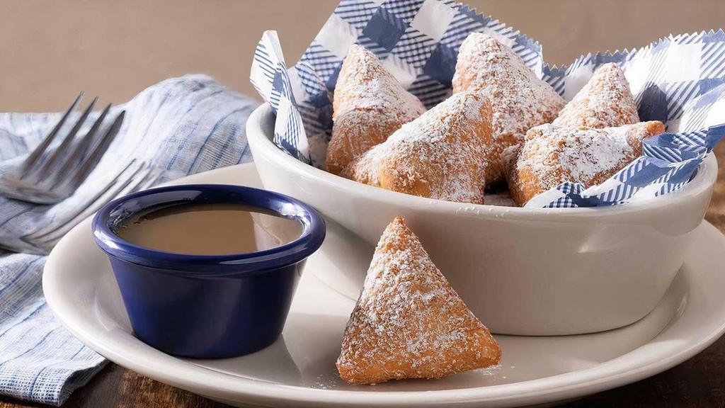 Biscuit Beignets · Our buttermilk biscuit dough, deep-fried then tossed in cinnamon sugar with butter pecan sauce for dipping.