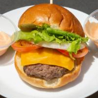 The Thom · Beef patty, tomato, lettuce, onion, American cheese, secret sauce, and on a brioche bun.