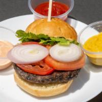 The Magda · Black bean patty, tomato, shallots, lettuce, ketchup, mustard, and on a vegan bun.