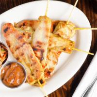 Chicken Satay · Grilled skewer marinated chicken breast. Served with peanut sauce and cucumber salad.