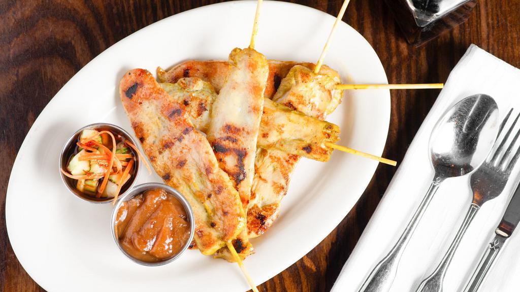 Chicken Satay · Grilled skewer marinated chicken breast. Served with peanut sauce and cucumber salad.