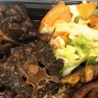 Oxtails  · Oxtails cooked to perfection. Served with rice and peas, cabbage and plantain