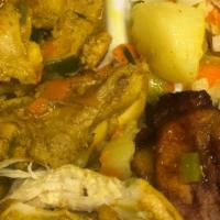 Curry Chicken  · Served with rice and peas, cabbage and plantain