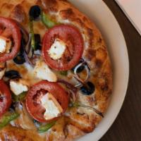Greek Pizza · Black olives, red onions, green peppers, tomatoes, garlic sauce, mozzarella and feta cheese.