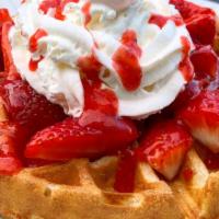 Strawberry Waffle · Belgian waffle topped with strawberries, strawberry drizzle, powdered sugar and whipped cream.