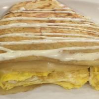 Egg And Cheese Crepe · Eggs, Provolone and Parmesan Cheese and ranch drizzle.