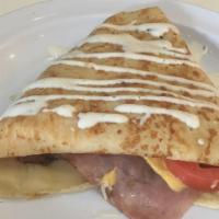 Ham 'N Cheese Crepe · Grilled ham slices, American cheese, parmesan cheese and ranch dressing drizzle on top.