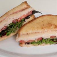 Turkey Sandwich · Sliced turkey, provolone cheese, tomatoes, spring mix, cranberry spared.