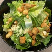 Caesar Salad · Romaine Lettuce, Croutons, Parmesan cheese and Caesar dressing.