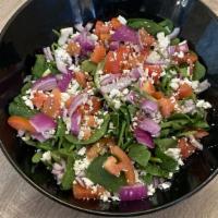 Green Salad · Spring mix, tomatoes, red onion, feta cheese, and balsamic dressing.