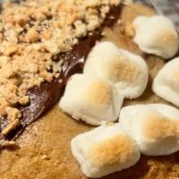 The S'Mores Cookie Brazil · Vanilla dough with white and milk chocolate.
Out: Half semi sweet crust with cracker / Half ...