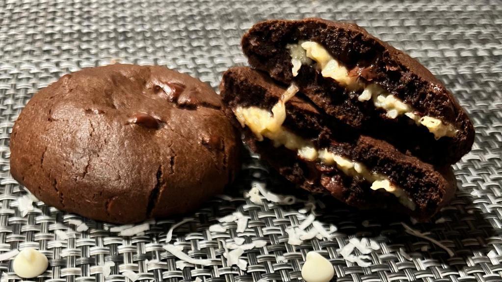 The Beijinho Cookie Brazil · Chocolate dough with dark chocolate drops.
 Filling: shredded coconut brigadeiro.  Toasted grated coconut..